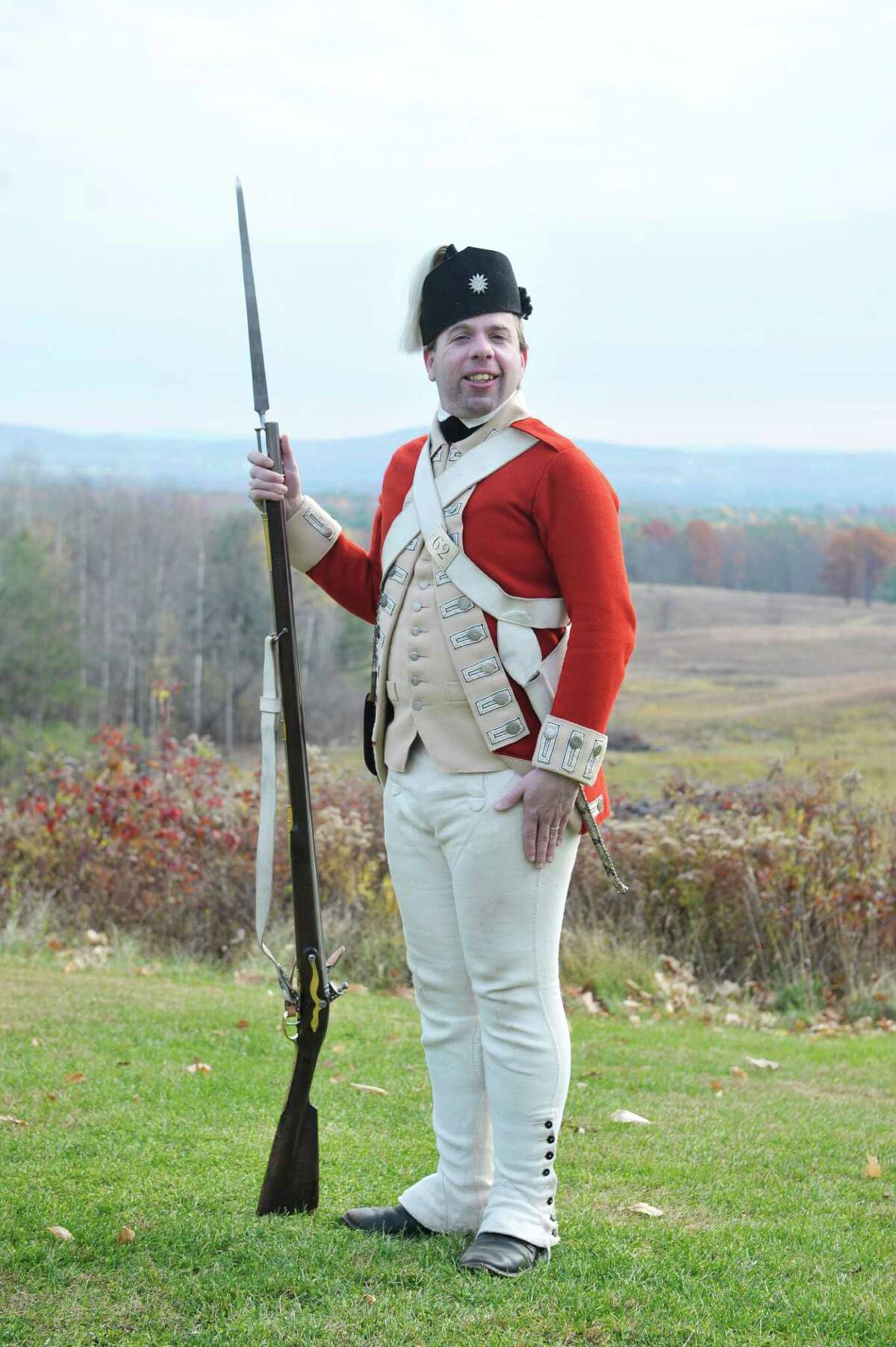 Reinactor Eric Schnitzer, dressed as a private soldier in the British 62nd Regiment in 1777, poses for a photograph at the Saratoga National Historical Park on Monday, Nov. 10, 2014, in Stillwater, N.Y. (Paul Buckowski / Times Union)
