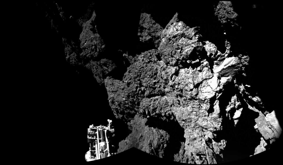 The combination photo of different images taken with the CIVA camera system released by the European Space Agency ESA on Thursday Nov. 13, 2014 shows Rosettaâs lander Philae as it is safely on the surface of Comet 67P/Churyumov-Gerasimenko, as these first CIVA images confirm. One of the landerâs three feet can be seen in the foreground. Philae became the first spacecraft to land on a comet when it touched down Wednesday on the comet, 67P/Churyumov-Gerasimenko. (AP Photo/Esa/Rosetta/Philae)