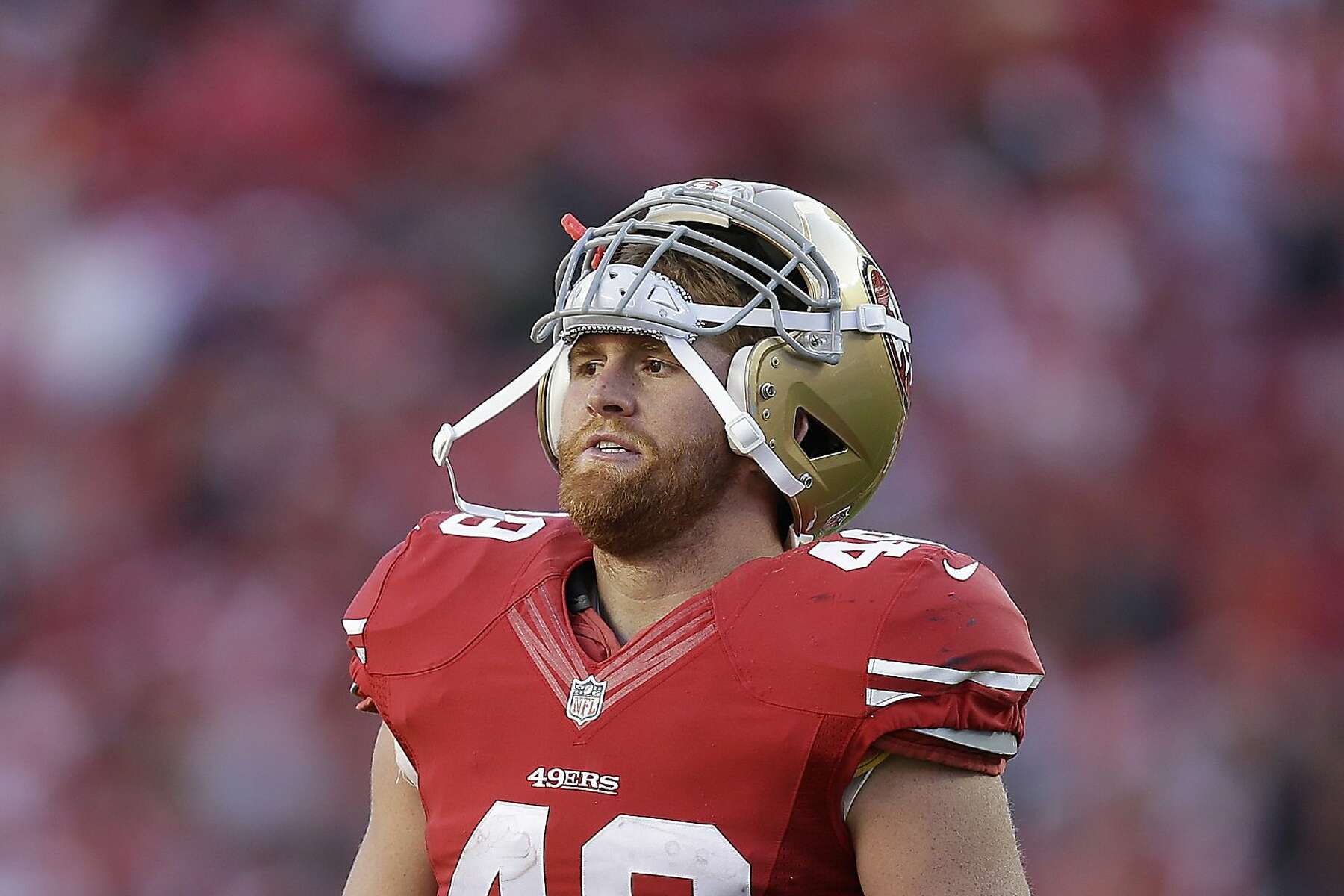 Fullback Bruce Miller of the San Francisco 49ers tries to tackle