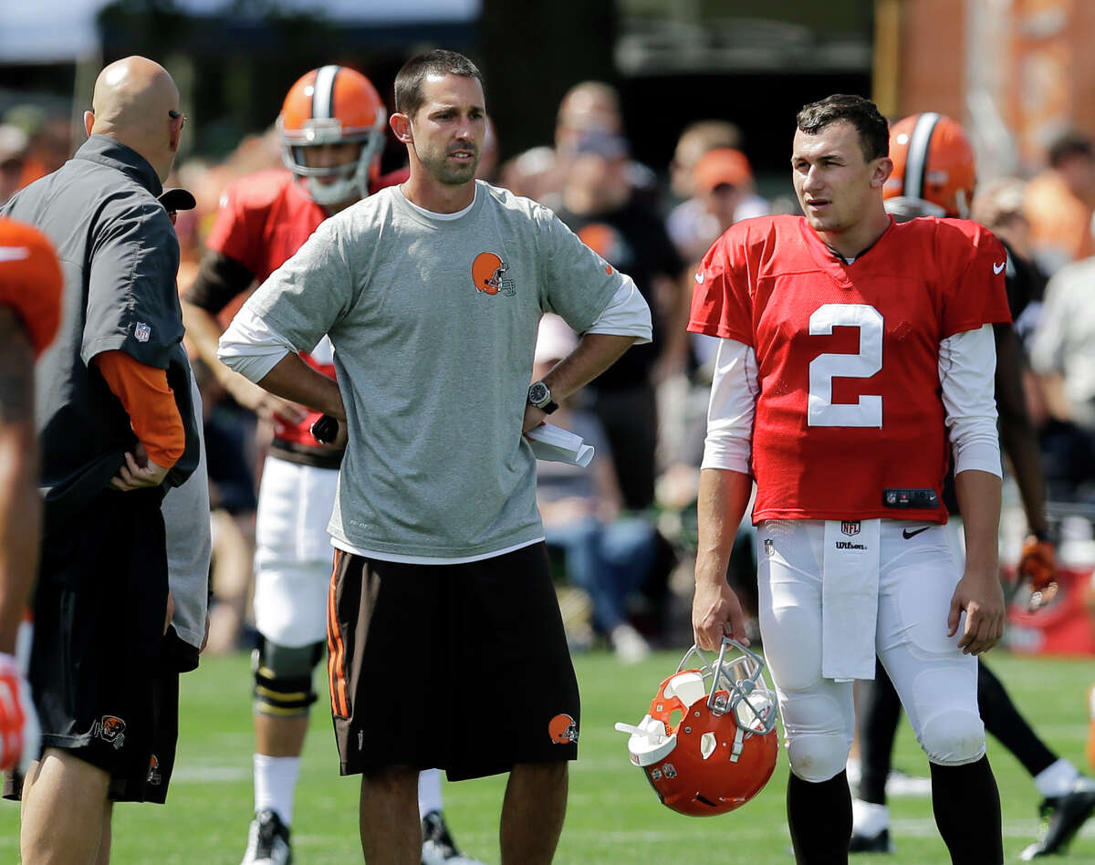 Browns backup QB Johnny Manziel, right, talks with offensive coordinator Kyle Shanahan, whose offense has been described as being quarterback-friendly.