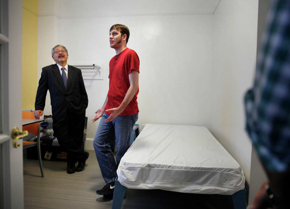 Mayor Ed Lee tours the inn with resident Michael S., who asked that his last name be withheld.