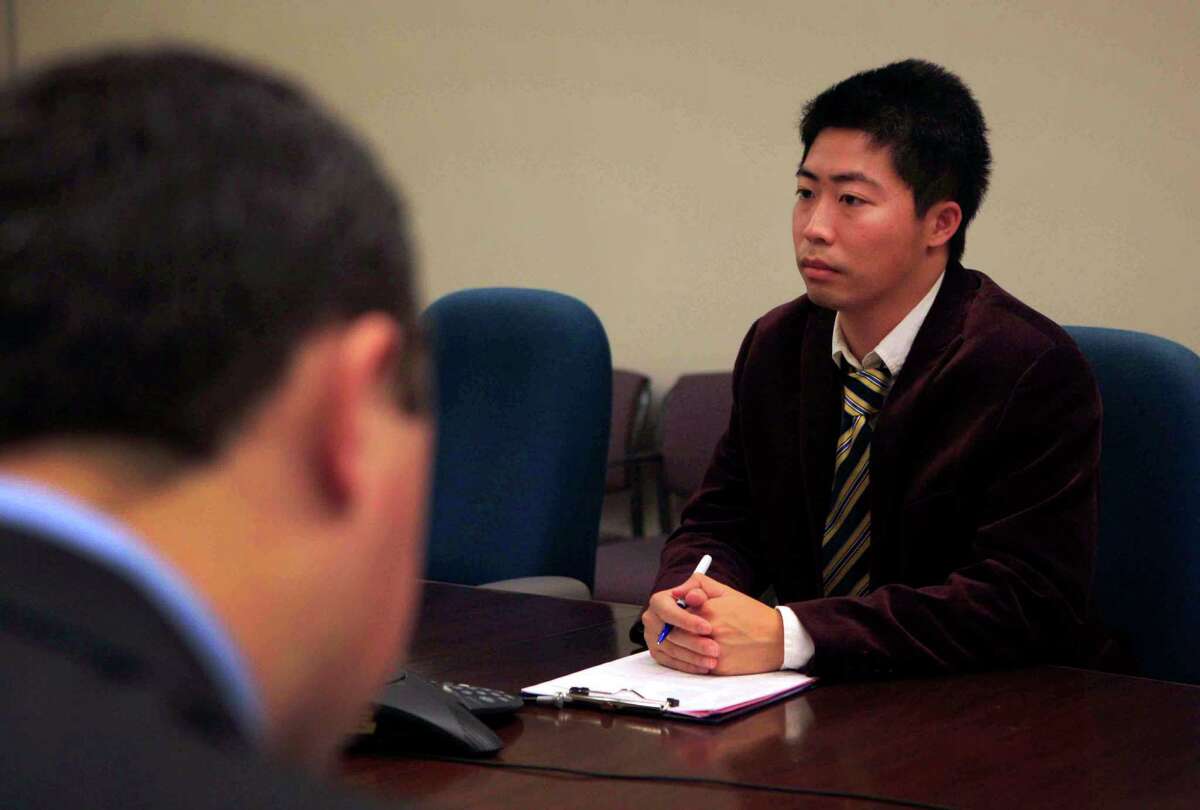 Timothy Ma, a student at UC Irvine, sits with other UC students before meeting with UC President Janet Napolitano at the University of California Office of the President in Oakland, Calif. Friday, November 14, 2014. The students' goal is to shine light on the lack of compliance with a state law requiring them to say how much is spent to educate individual groups of students.