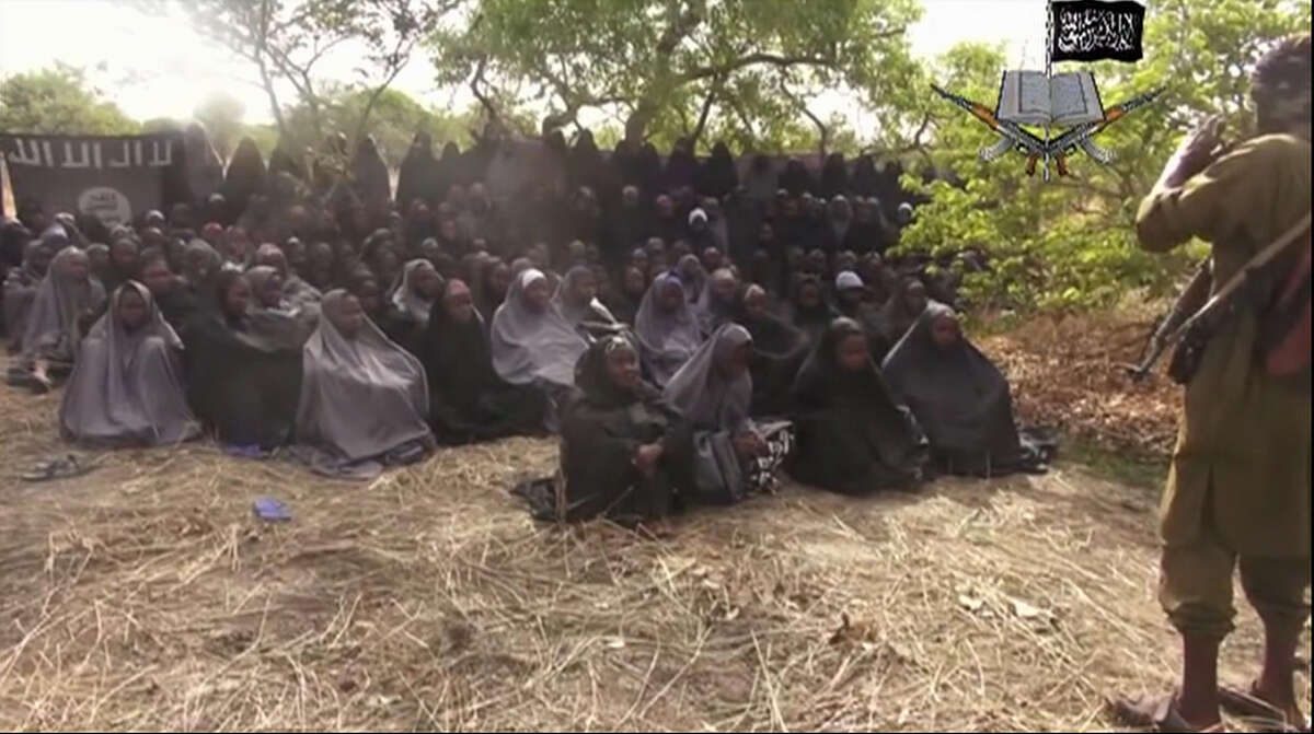 FILE - This Monday, May 12, 2014, file image taken from video by Nigeria's Boko Haram terrorist network, shows the alleged missing girls abducted from the northeastern town of Chibok. Islamic extremists in Nigeria have seized Chibok, forcing thousands of residents to flee the northeastern town from which the insurgents kidnapped nearly 300 schoolgirls in April, a local official said Friday, Nov. 14, 2014. (AP Photo/File)