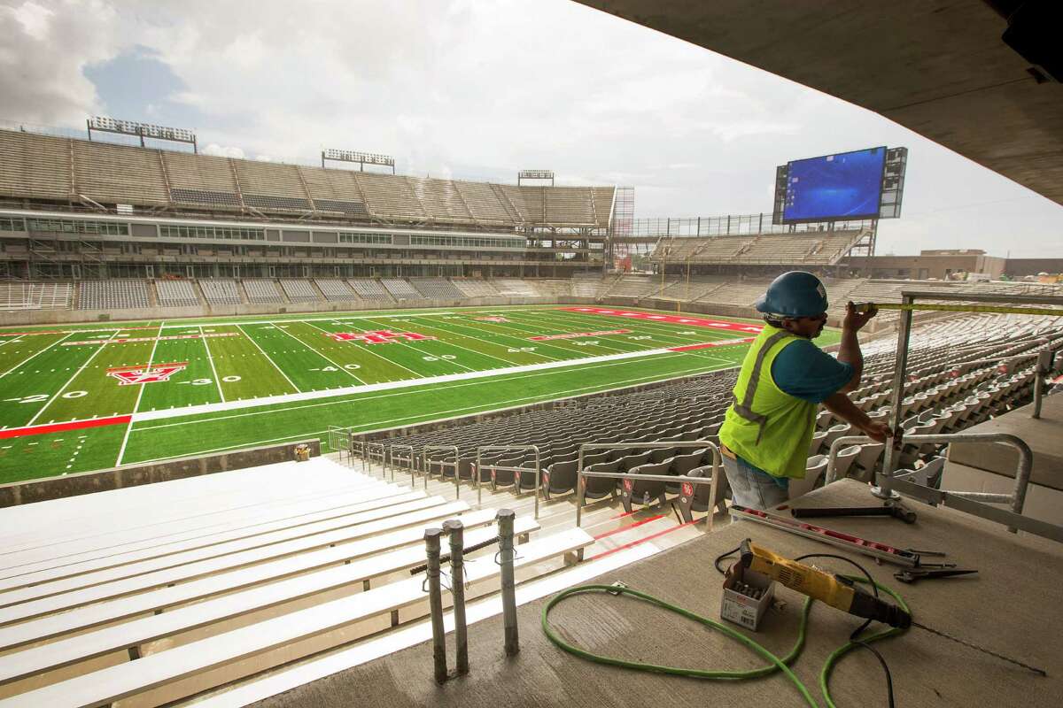 Elvis Hernandez works on installing a guardrail at TDECU Stadium on the University of Houston Campus Tuesday, Aug. 5, 2014, in Houston. TDECU Stadium is scheduled to open on August 29, went UH plays the University of Texas-San Antonio. ( Brett Coomer / Houston Chronicle )