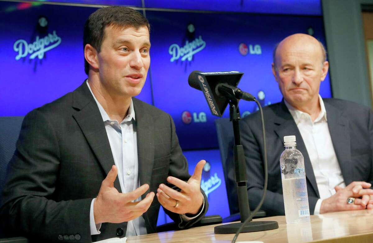 Andrew Friedman, left, a 38-year-old Houston native and former Wall Street analyst, was hired away from the Tampa Bay Rays by the Los Angeles Dodgers to help give the West Coast club a high-powered, high-priced front office.