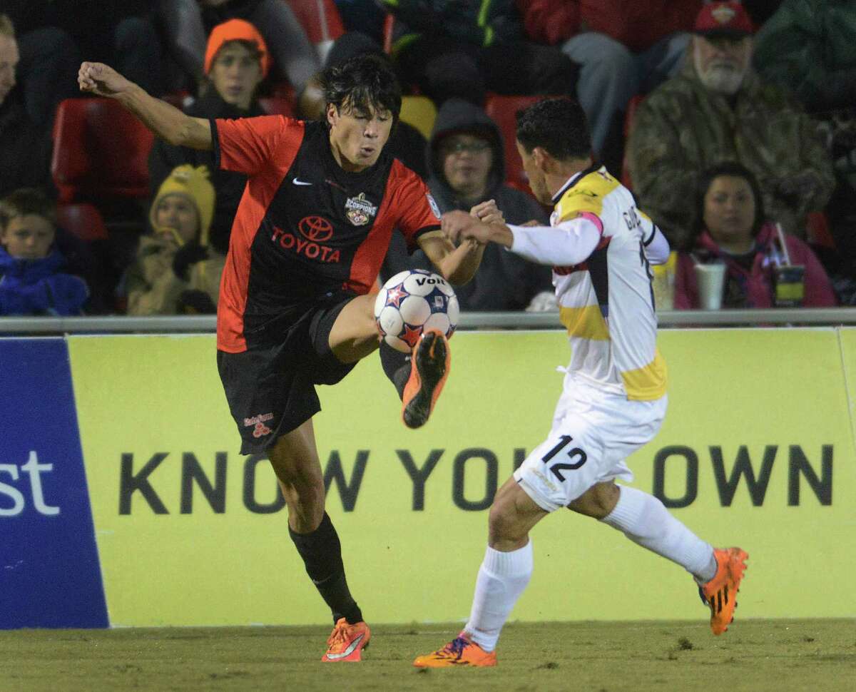 Walter Restrepo of the San Antonio Scorpions kicks the ball as Ivan Guerrero of the Ft. Lauderdale Strikers defends during the first half of the NASL Championship Final at Toyota Field on Saturday, Nov. 15, 2014.