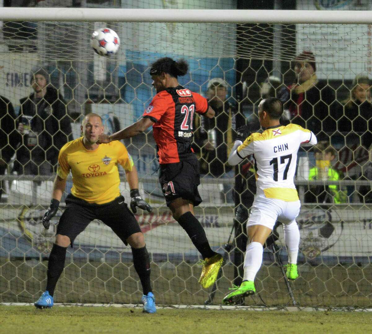 Stephen DeRoux (21) and goalkeeper Josh Saunders of the San Antonio Scorpions defend as Shawn Chin (17) of the Ft. Lauderdale Strikers attempts to get the ball in the net during the first half of the NASL Championship Final at Toyota Field on Saturday, Nov. 15, 2014.
