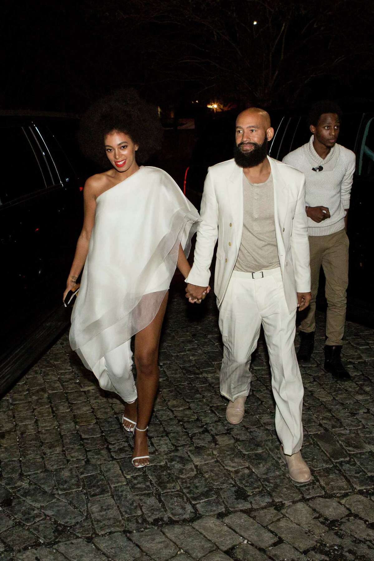 Musician Solange Knowles (wearing Stephane Rolland with Stuart Weitzman shoes and a Lee Savage clutch) and her fiancee, music video director Alan Ferguson (wearing Costume National with an H&M shirt and Maison Martin Margiela shoes), arrive for their rehearsal dinner at the Felicity Street Methodist Church on November 15, 2014 in New Orleans, Louisiana. (Photo by Josh Brasted/WireImage)AP story: Solange Knowles weds video director