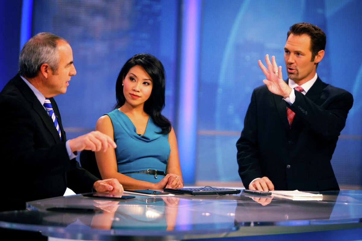 FILE-- Anchor Veronica De La Cruz and co-anchor Ken Bastida discuss the weather with meteorologist Paul Deanno on the 6pm KPIX 5 newscast at KPIX's Studios on November 11, 2014 in San Francisco. The 4-year-old son of Veronica De La Cruz, a KPIX anchor, was mauled by a family friend’s dog Monday and underwent surgery for his injuries.