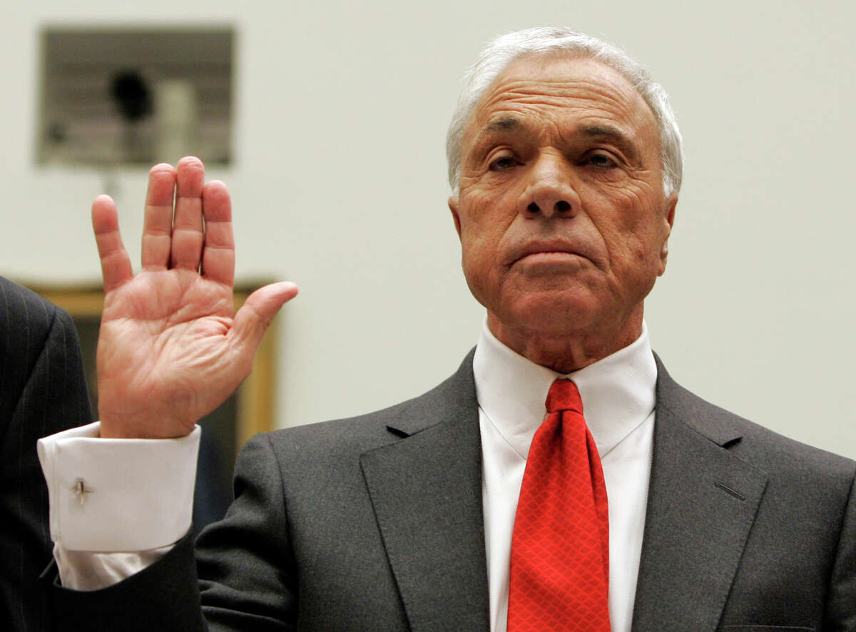 Angelo Mozilo, founder and former CEO of Countrywide Financial Corporation, center, is sworn in at the House Oversight and Government Reform Committee hearing on Capitol Hill in Washington, March 7, 2008, in Washington. The committee is examining the compensation and retirement packages granted to the CEOs of corporations deeply involved in the current mortgage crisis. (AP Photos/Susan Walsh)