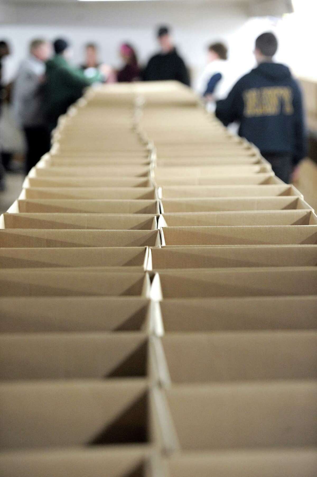 Boxes that will be filled with food and distributed by Brotherhood In Action for their Thanksgiving action week are assembled in a basement storage area in Bethel, Conn, on Tuesday, November 18, 2014.