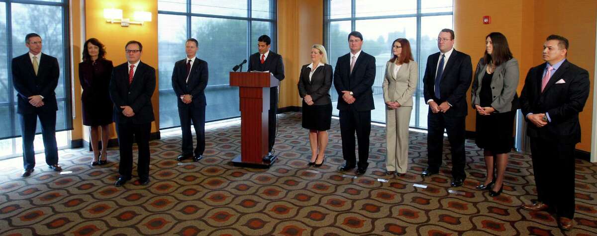 District Attorney-elect Nico LaHood, at lecturn, introduces his top staff Tuesday Nov. 18, 2014 during a news conference at the Wyndham Garden Riverwalk hotel. Seen from left, are: Woody Halstead, first assistant district attorney; Juanita Vasquez-Gardner, chief administrative attorney; Enrico Valdez, chief of appellate division; Edward Schweninger, chief of civil division; Wendy McClellan, chief of intake division; Michael Hoyle, chief of criminal trial division; Emily Angulo, chief of misdemeanor division; Jim Wheat, chief of special crimes division; Rose Zebell, chief of juvenile crimes division and Willie Ng, Jr., chief investigator