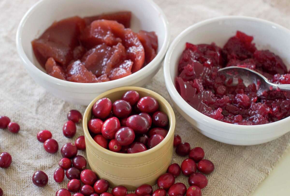 Side dishes can make any dinner stand out and can be tweaked for those who have dietary or other issues. Left, jellied cranberry sauce; right, cranberry sauce made with whole berries.