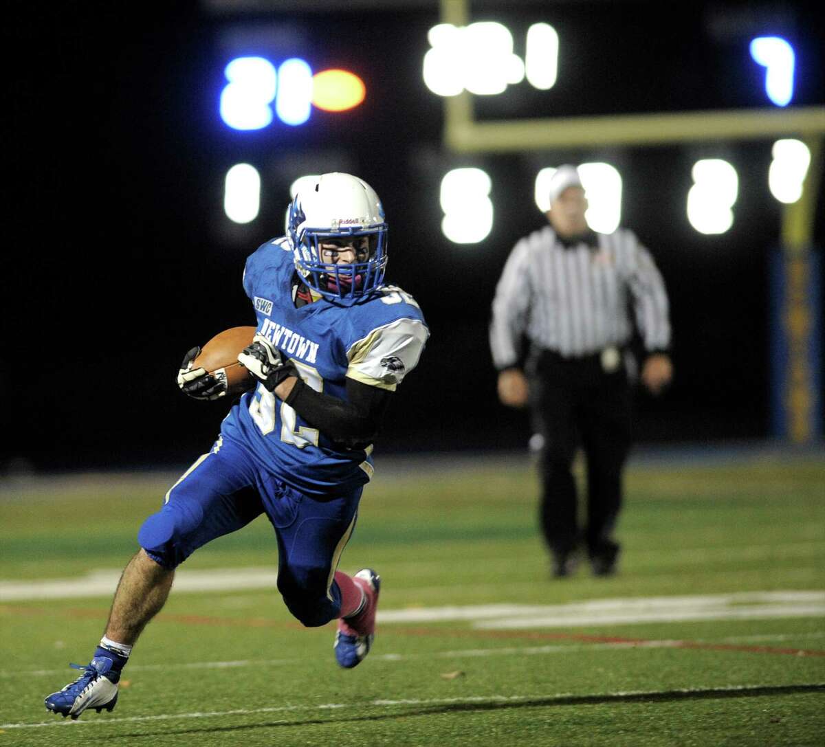 Photographs from the Brookfield at Newtown High School boys football game, Friday night, October 24, 2014, in Newtown, Conn. Newtown #32 Jaret Devellis