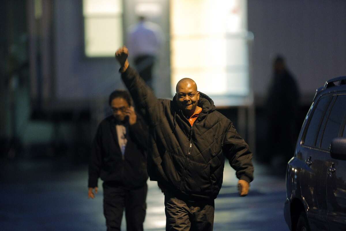 Demaurae Houston, a driver for Loop Transportation, raises his fist in triumph as their vote to unionize was affirmed on Wednesday. Employees of Loop Transportation voted on Wednesday, November 19, 2014, to unionize and join Teamsters Local 853 at the company's headquarters in San Carlos, Calif. The employees are the first tech bus drivers to unionize, seeking better working conditions.