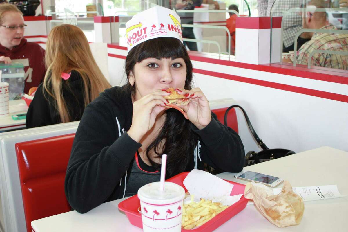 Fans of In-N-Out enjoy opening day at the first store in San Antonio on Thursday, Nov. 20, 2014.
