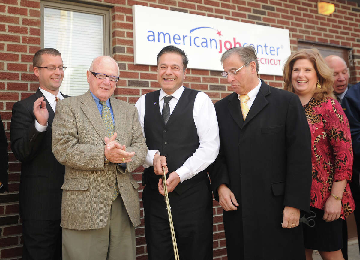 From left; State Senator Joe Crisco, Ansonia Mayor David Cassetti, and The WorkPlace President and CEO Joe Carbone cut the ribbon on The WorkPlace's new American Job Center at 4 Fourth Street in Ansonia, Conn. on Thursday, November 20, 2014.