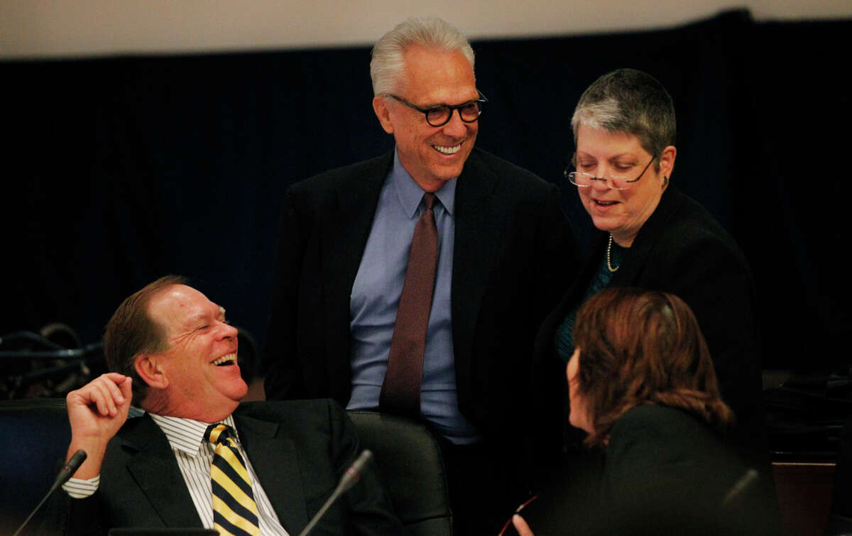 Regents Russell Gould (left), Norman Pattiz, UC President Janet Napolitano and Bonnie Reiss chat as the public enters for their comment part of a closed UC regents meeting at the UCSF Mission Bay campus Nov. 20, 2014 in San Francisco. A lawsuit was filed against Pattiz stating the UC regent brandished a loaded weapon at an employee.