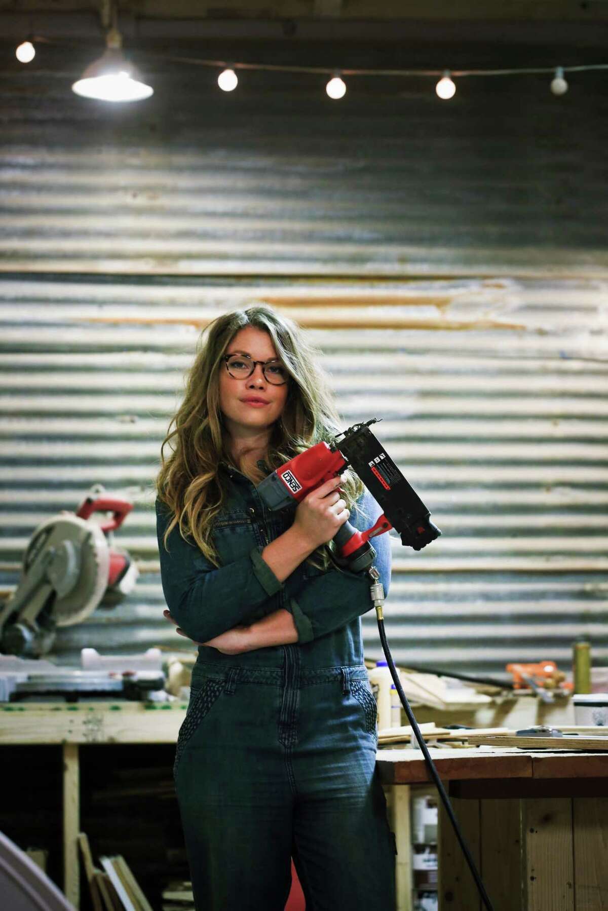 Woodworker Aleksandra Zee with some of the tools of her trade in her S.F. workshop.