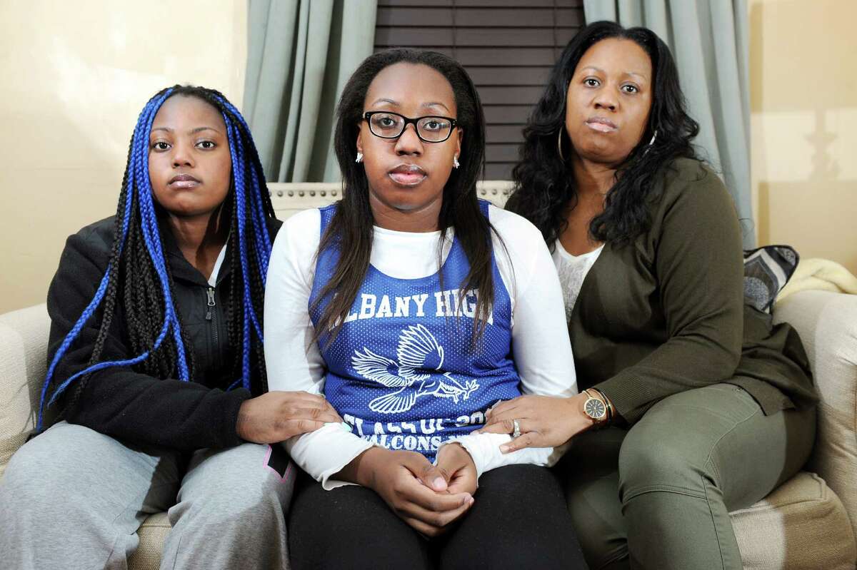 Kori Dobbs, 17, center, with her sister Camille Dobbs, 14, left, and their mother Selina Dobbs on Thursday, Nov. 20, 2014, at their home in Albany, N.Y. Kori was recently elected Senior Class President and has faced ugly, racist harassment on Twitter and social media. (Cindy Schultz / Times Union)
