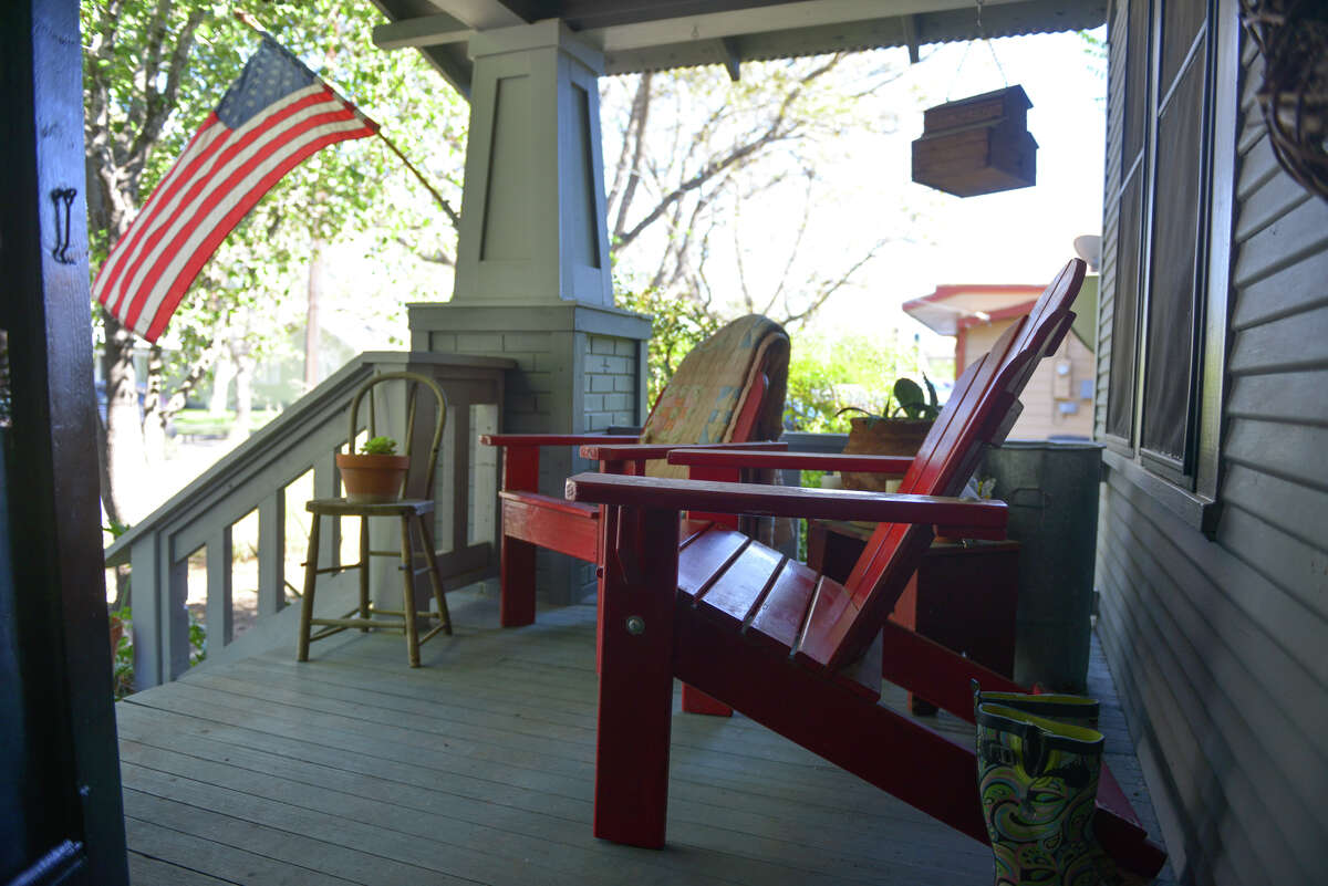 Andy Rogers made the red adirondack chairs on the front porch from bunk bed frames. He and his wife, Tanya, and their daughters enjoy projects for their 1920s cottage in New Braunfels.