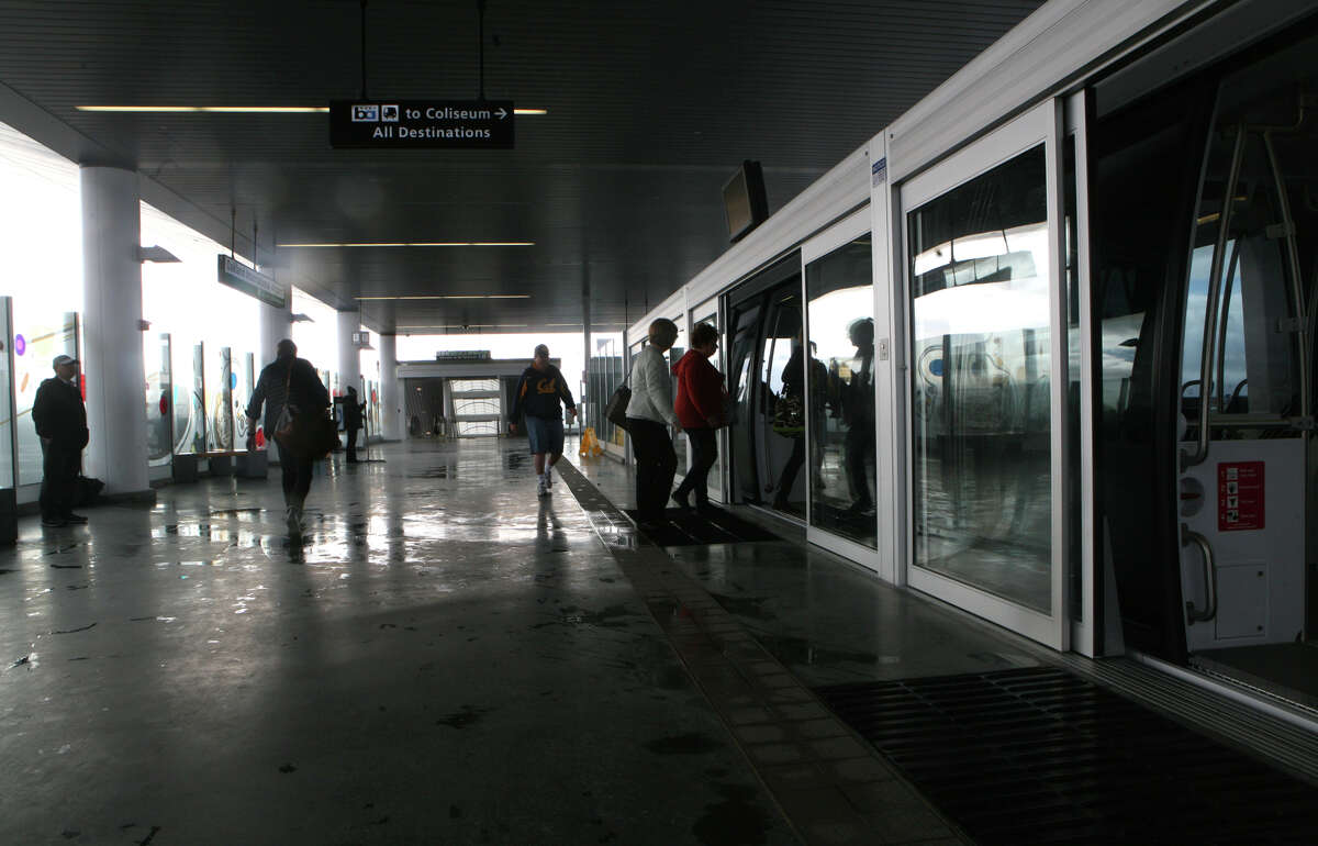 Passengers board the shuttle at the Oakland airport for the ride to the Coliseum Station, where riders can board regular BART trains.