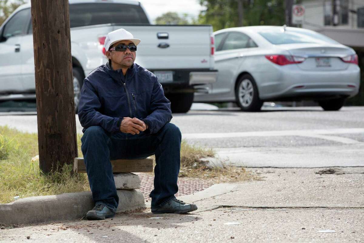 Oscar, 33, a day laborer and ﻿illegal immigrant from Honduras, waits for work last week on the corner of Durham and All﻿en﻿. ﻿He said there are days when he can make about $100 to $150, other days ﻿nothing.﻿ He said ﻿working legally would ﻿help him get work﻿ more easily. ﻿ "I would be a painter, or roofer or do landscaping," he said.﻿