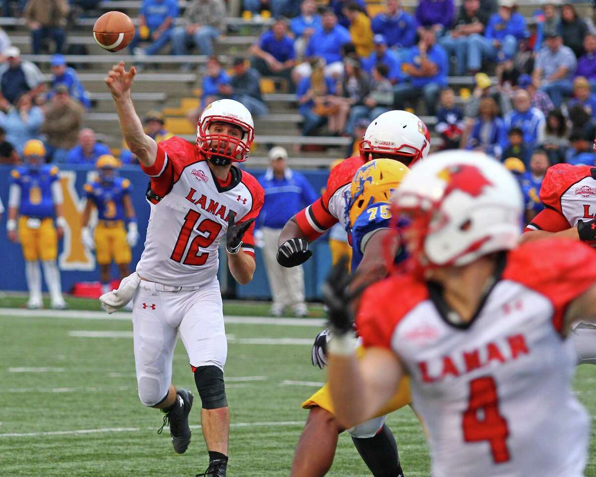 Caleb Berry passes the ball to Jayce Nelson during the first half of the game between the Lamar Cardinals and the McNeese State University Cowboys at Cowboy Stadium in Lake Charles, LA, November 22, 2014 (photo provided by Kyle Ezell).