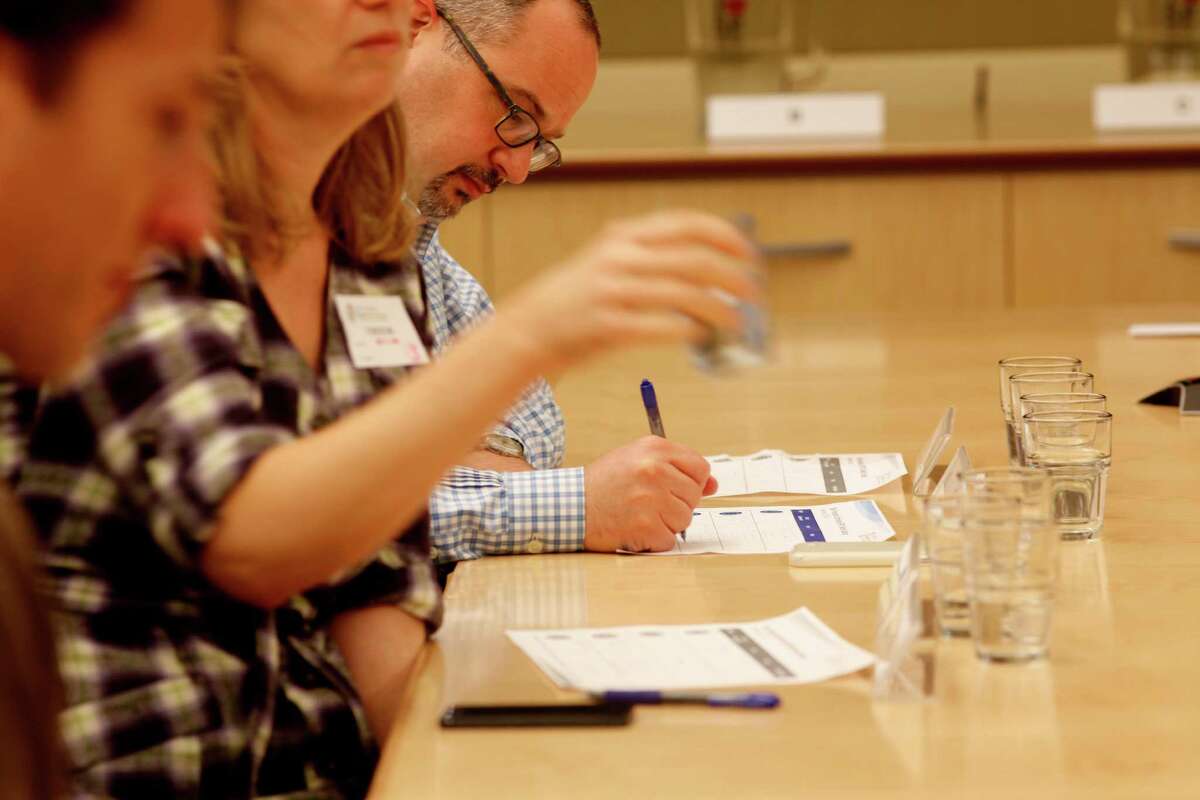 San Francisco Chronicle wine editor Jon Bonné takes notes during his tap water taste test at the San Francisco Public Utilities Commission. They included the city’s current water, the 13.5 percent groundwater blend, bottled Arrowhead water and a duplicate of one of the samples.