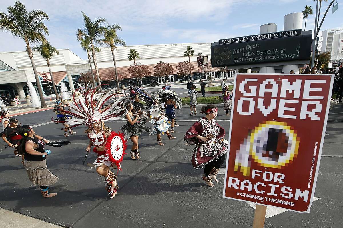 A group protests the Washington Redskins name across from Levi's Stadium before an NFL football game between the Redskins and the San Francisco 49ers in Santa Clara, Calif., Sunday, Nov. 23, 2014.