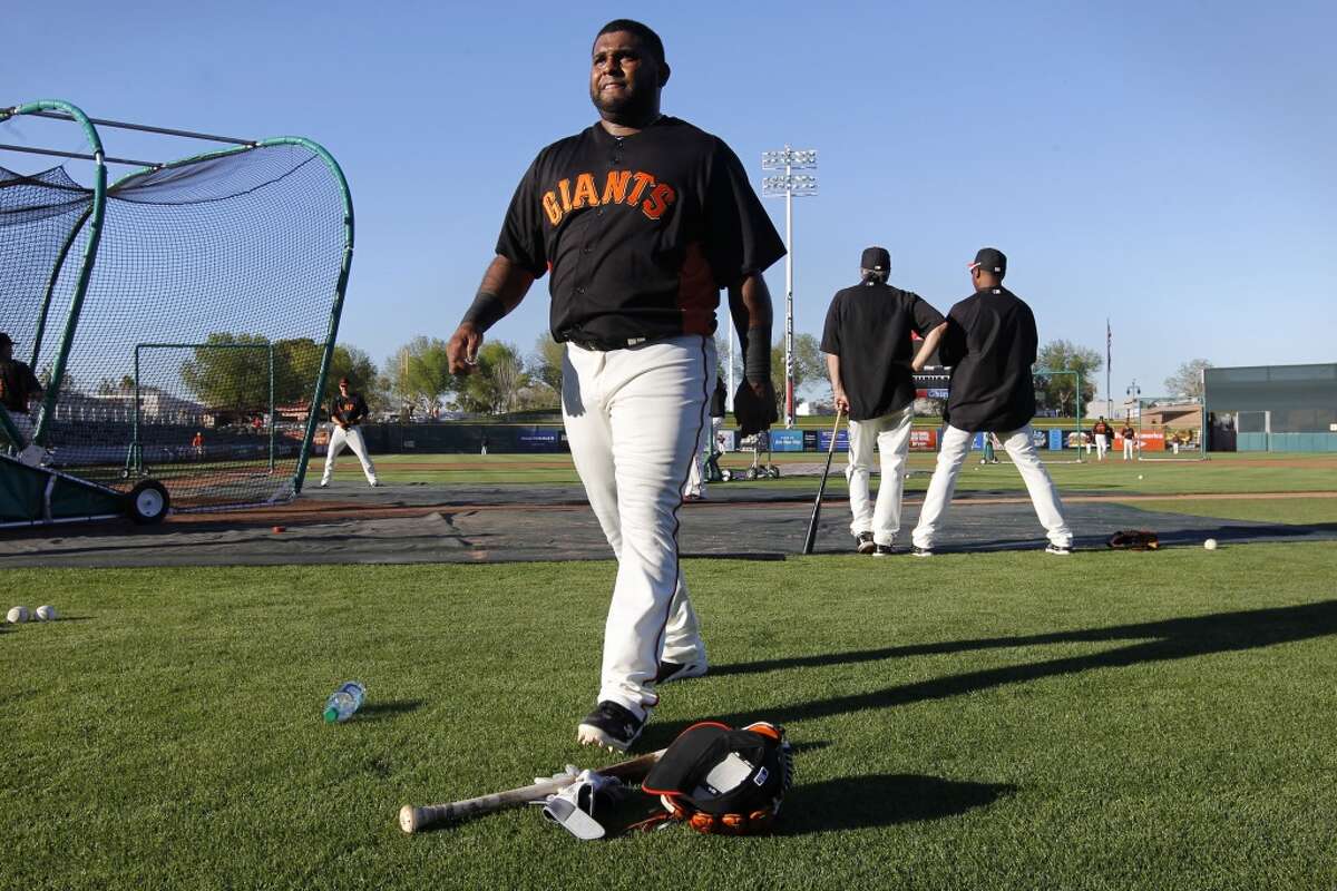 Sandoval takes a break during pre-game workouts as the San Francisco Giants prepare to take on the San Diego Padres at Scottsdale Stadium in spring training.