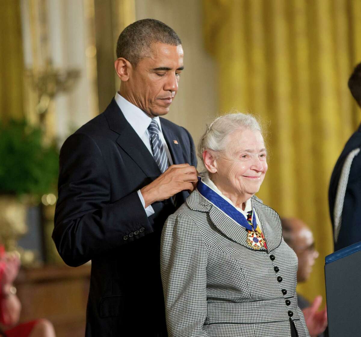 President Barack Obama awards professor, Mildred Dresselhaus, the Presidential Medal of Freedom, Monday, Nov. 24, 2014, during a ceremony in the East Room of the White House in Washington. President Obama is presenting the nation's highest civilian honor to 19 artists, activists, public servants and others. (AP Photo/Pablo Martinez Monsivais)