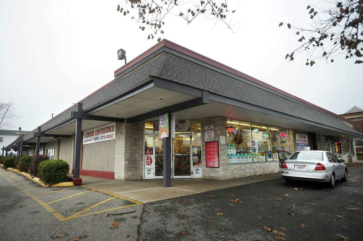 The building housing Corner Convenience and adjoining parking lot, at 58 River Street in downtown Milford, Conn., is one of several properties the city plans to purchase to increase parking for the train station and downtown retailers on Monday, November 24, 2014.