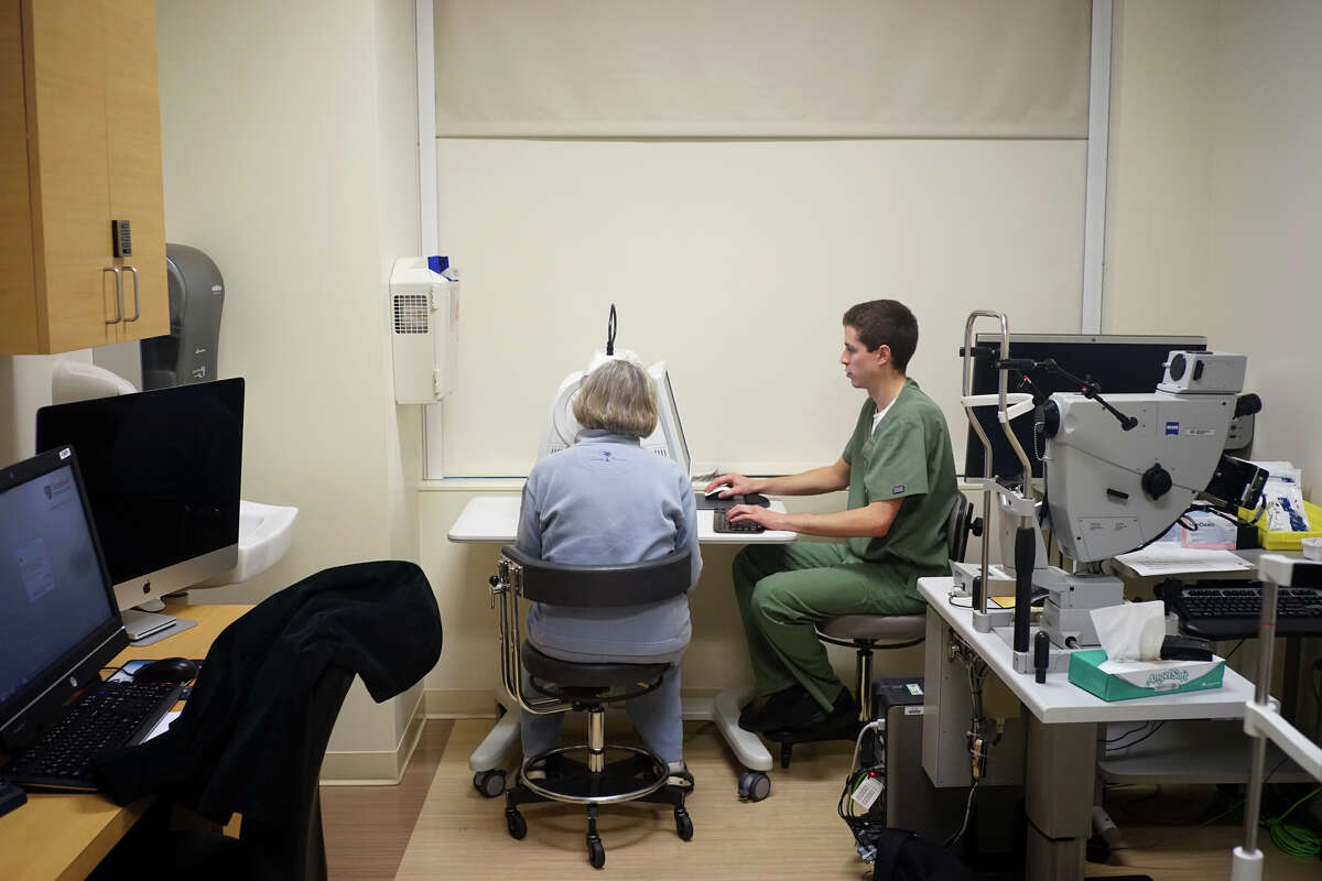 A patient undergoes an OCT eye test administered by Ryan Nelson on Thursday, Nov. 20, 2014 in Palo Alto, Calif. Leng has discovered an algorithm that can determine if patients will lose their eyesight due to macular degeneration.