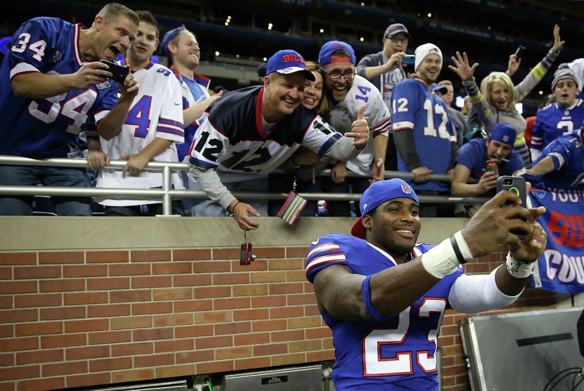 Ford Field in Detroit becomes a western suburb of Buffalo as the Bills' Aaron Williams takes a selfie with fans who fled the snow for a free ticket.