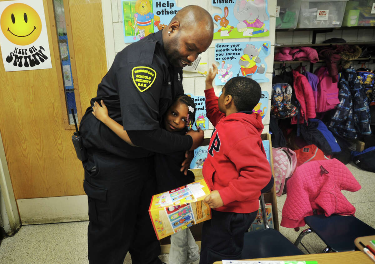 School security guard inspires students with coloring book