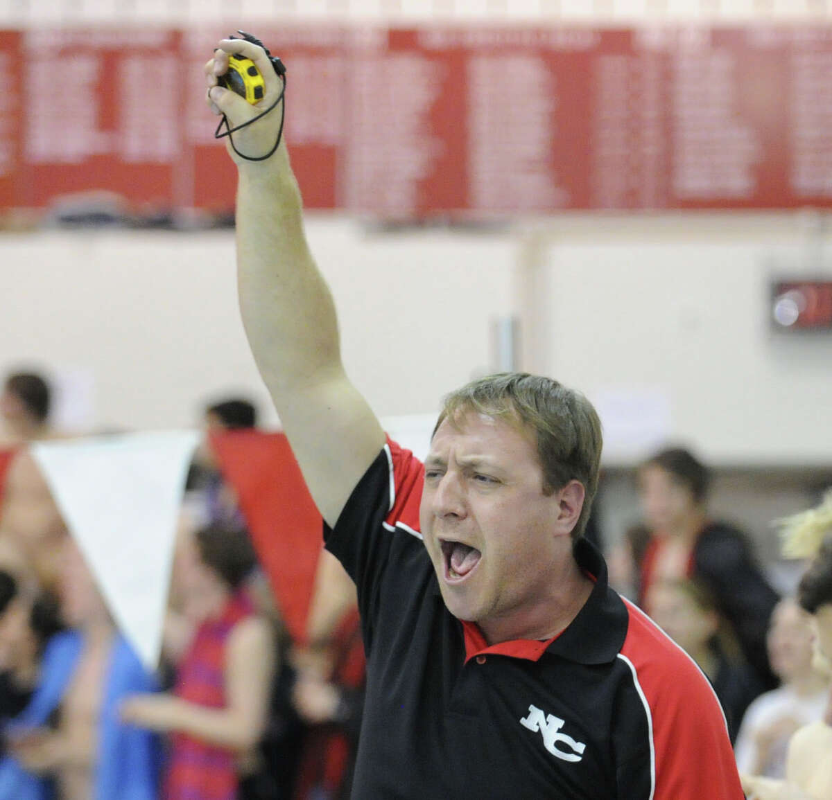 New Canaan swim coach Dave Fine during the FCIAC Swimming championships at Greenwich High School, Thursday night, Feb. 28, 2013.