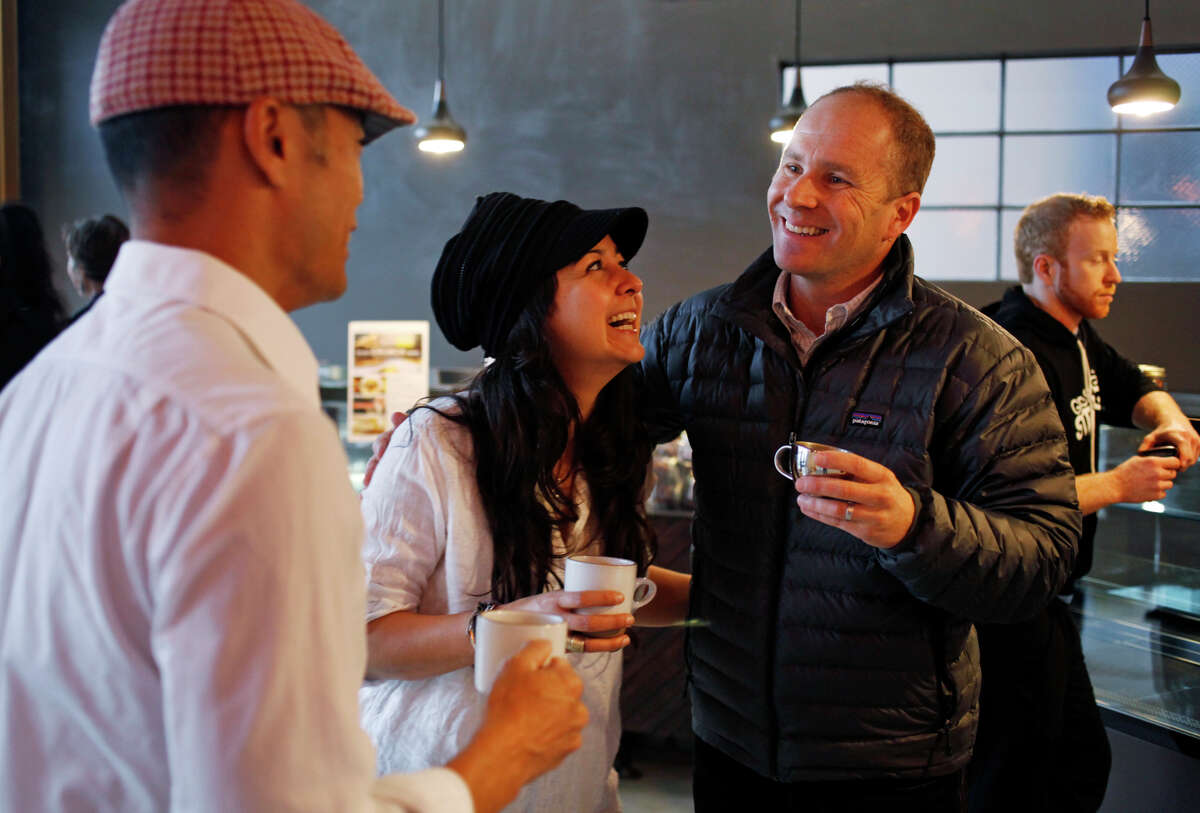 Mission Heirloom owners Bobby Chang (left) and Yrmis Barroeta celebrate the opening day of Vine + Shattuck cafe with cafe landlord Ito Ripsteen.