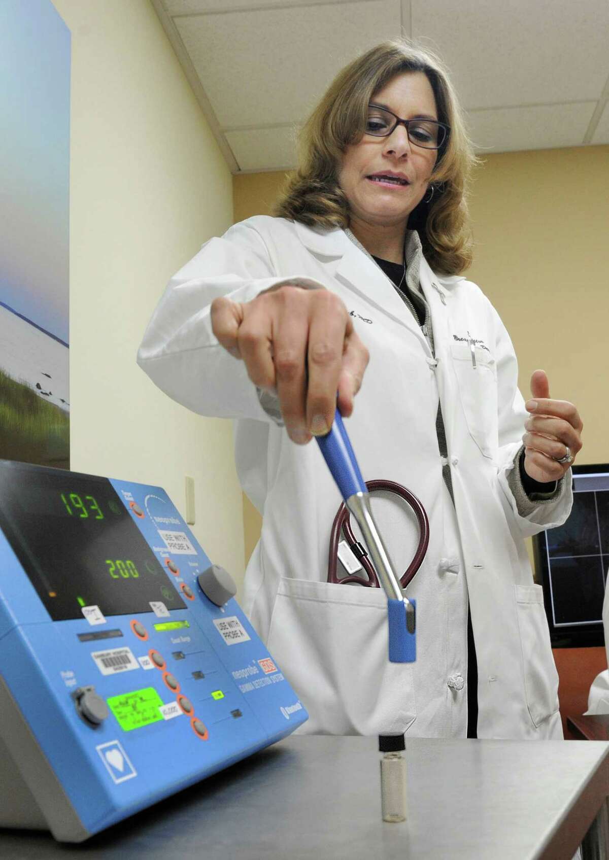 Dr. Valerie Staradub explains a technology that uses radioactive seed localization to remove spots on a woman's breast, Tuesday, Nov. 24, 2014 at Danbury Hospital. Western Connecticut Health Network is the first provider in the state of Connecticut to offer this new technology to accurately locate spots that cannot be felt.