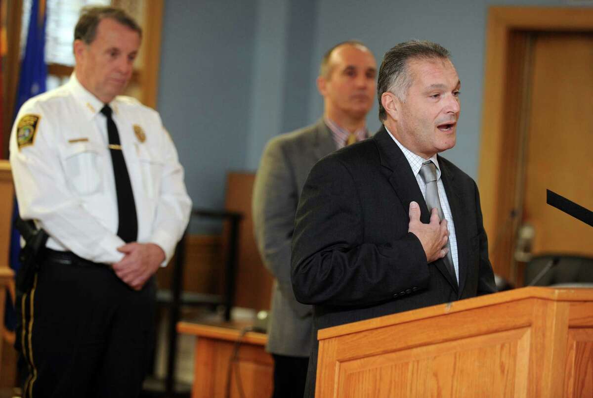 Michael Lombardi is named the new police chief for Trumbull Wednesday, Nov. 26, 2014, during an announcement at Town Hall. Lombardi will replace Police Chief Thomas Kiely, far left, who is retiring on Jan. 1, after 40 years of service with the force.