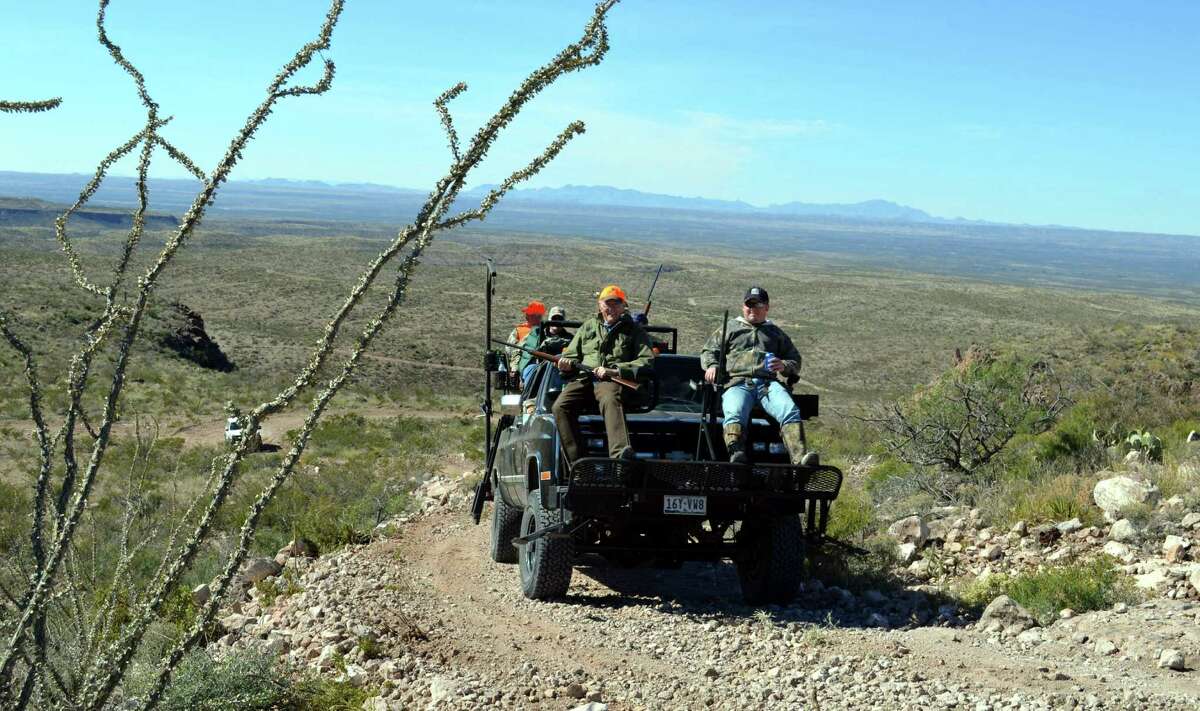 Riding up a rugged hill that is home to good numbers of scaled quail this year, Charlie Duke, left, and Zane Goodspeed enjoy a break from busting brush and maneuvering around rocks in the West Texas terrain.