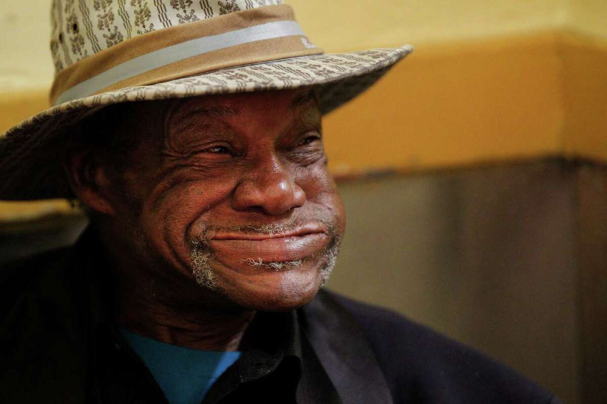 Claude Holman smiles as he eats his meal at Glide Memorial Church during their annual Thanksgiving dinner Nov. 27, 2014 in San Francisco, Calif. The church served nearly 5,000 Thanksgiving meals to people in the community throughout the day.