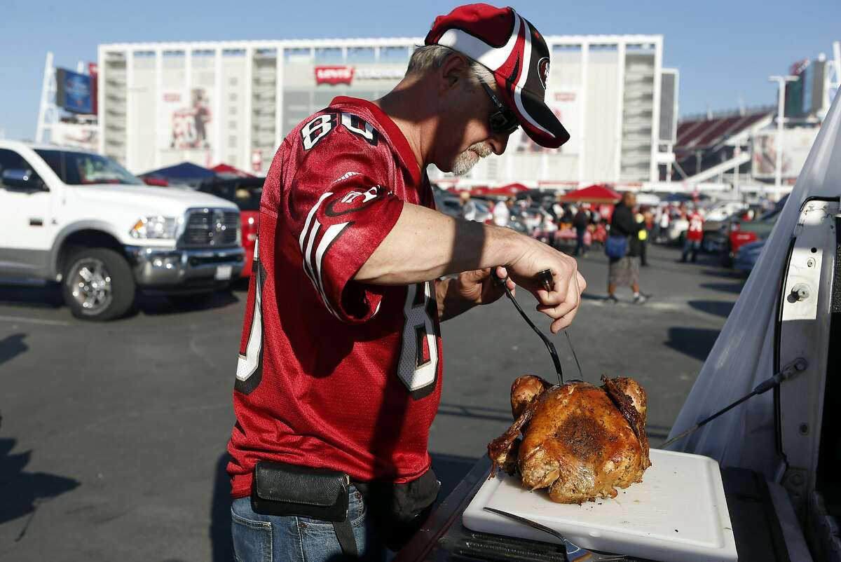 Randy Richey carves a Thanksgiving turkey before the Niners play the Seattle Seahawks at Levi's Stadium in Santa Clara, Calif., on Thursday, November 27, 2014.