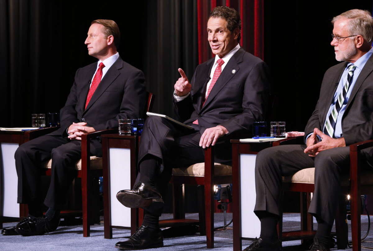New York gubernatorial candidates, from left, Rob Astorino, Gov. Andrew Cuomo and Howie Hawkins participate in a debate sponsored by The Buffalo News and WNED-WBFO at WNED Studios in Buffalo, N.Y., Wednesday, Oct. 22, 2014. (AP Photo/The Buffalo News,Dererk Gee ) TV OUT; MAGS OUT; MANDATORY CREDIT; BATAVIA DAILY NEWS OUT; DUNKIRK OBSERVER OUT; JAMESTOWN POST-JOURNAL OUT; LOCKPORT UNION-SUN JOURNAL OUT; NIAGARA GAZETTE OUT; OLEAN TIMES-HERALD OUT; SALAMANCA PRESS OUT; TONAWANDA NEWS OUT ORG XMIT: NYBUE102