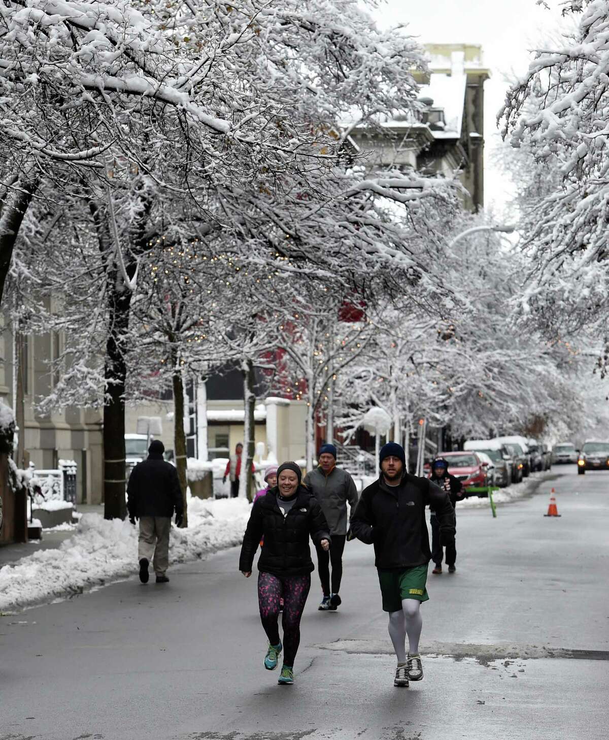 Nov. 26-27, 2014: Runners warm up under the snow covered trees before the 5K Troy Turkey Trot race on Thanksgiving Day Nov. 27, 2014. (Skip Dickstein/Times Union)