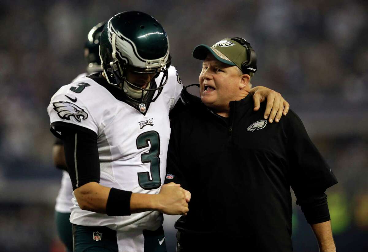 Mark Sanchez celebrates with head coach Chip Kelly after LeSean McCoy scored on a running play.