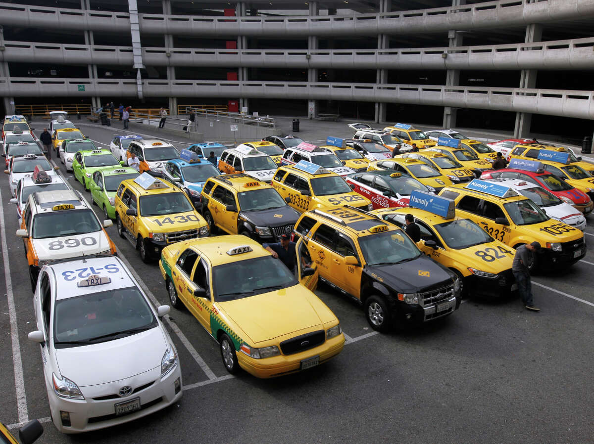 Cabs in a staging area await service at San Francisco International Airport.