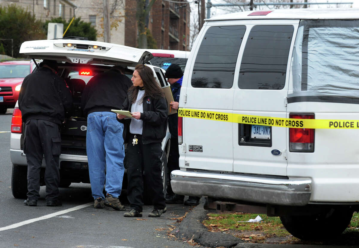 Police investigate a shooting that took place during the Harding High football game along Boston Avenue in Bridgeport, Conn. on Thursday Nov. 27, 2014.