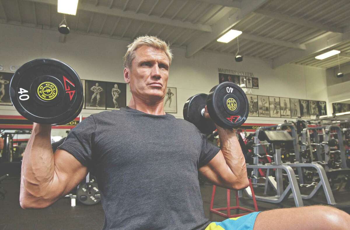 Starting position: Hold the dumbbells at shoulder level with the palms of the hands pointing inward. (A shoulder exercise from "Dolph Lundgren: Train Like an Action Hero: Be Fit Forever ")