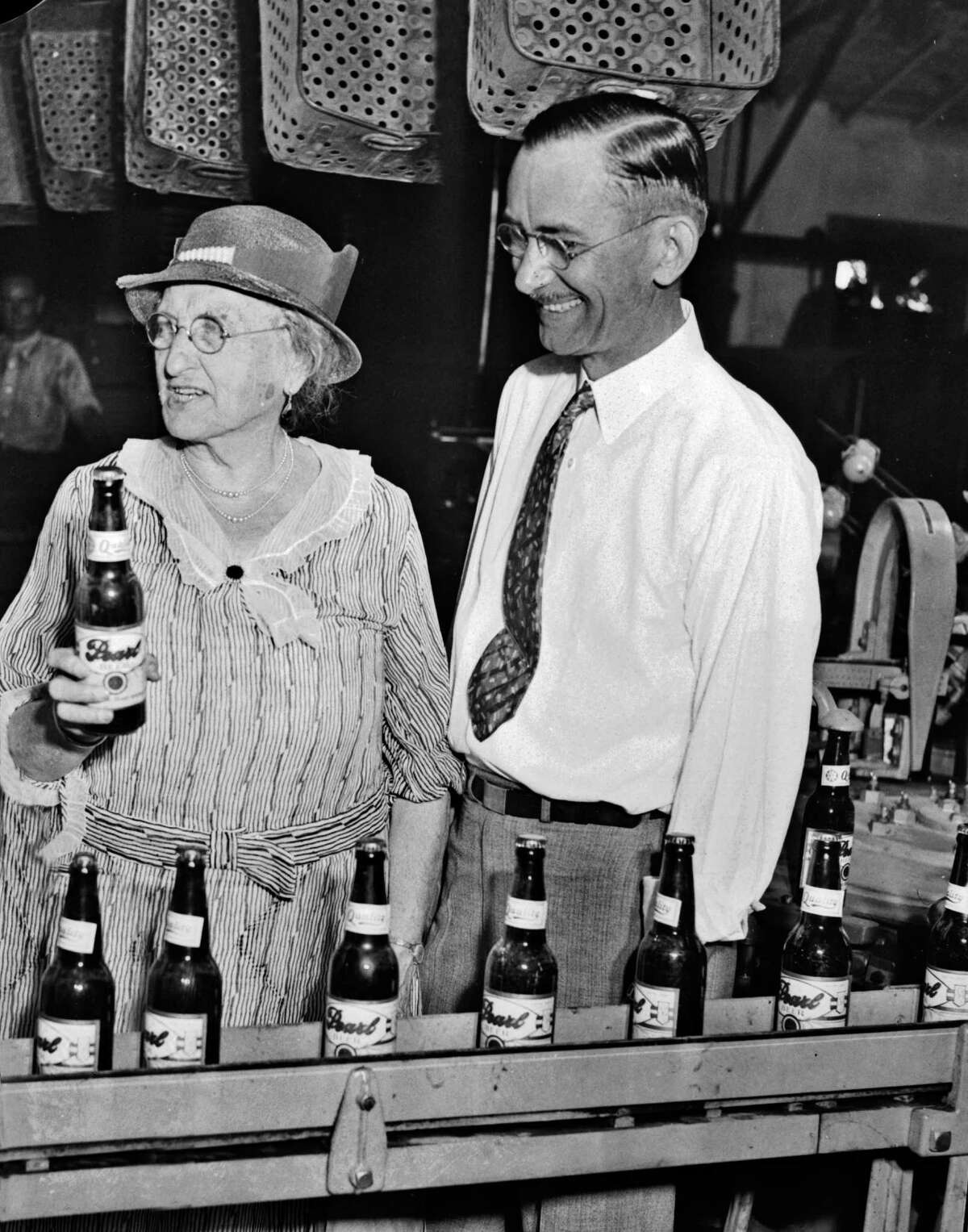 Emma Koehler, widow of San Antonio Brewery Association founder Otto Koehler, and brewery general manager B.B. McGimsey watch the first bottle of Pearl beer leave the vats after the repeal of Prohibition in 1933. ﻿ ﻿